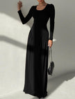 Black solid U-neck fit and flare dress by FJØRNA, showcasing a stylish, elegant silhouette and smooth fabric.