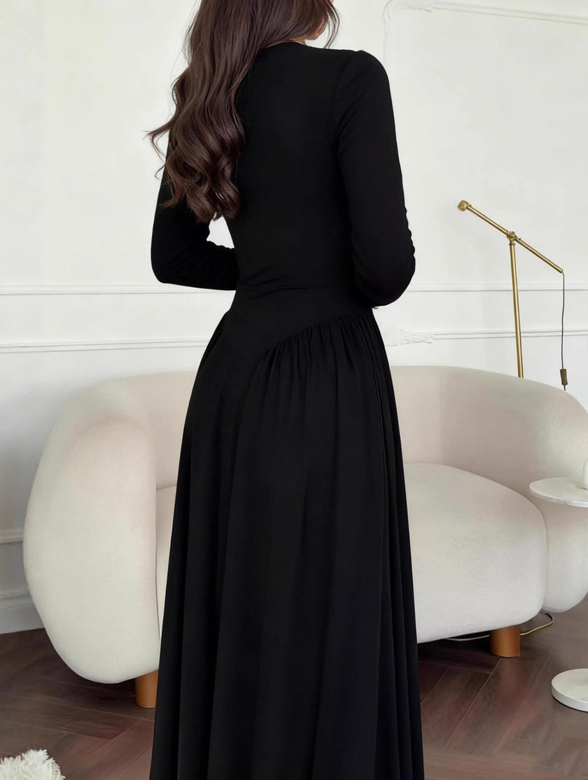 Black solid U-neck fit and flare dress by FJØRNA featuring a stylish silhouette and elegant design.