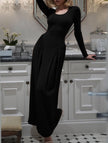 FJØRNA solid white U-neck fit and flare dress shown in black, featuring a flattering silhouette and stylish design.