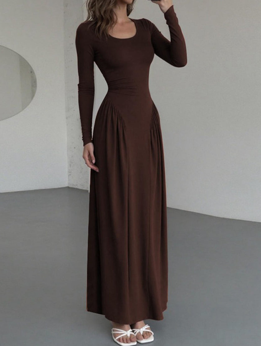 White solid U-neck fit and flare dress by FJØRNA, featuring a stylish silhouette and elegant design, shown on a model.