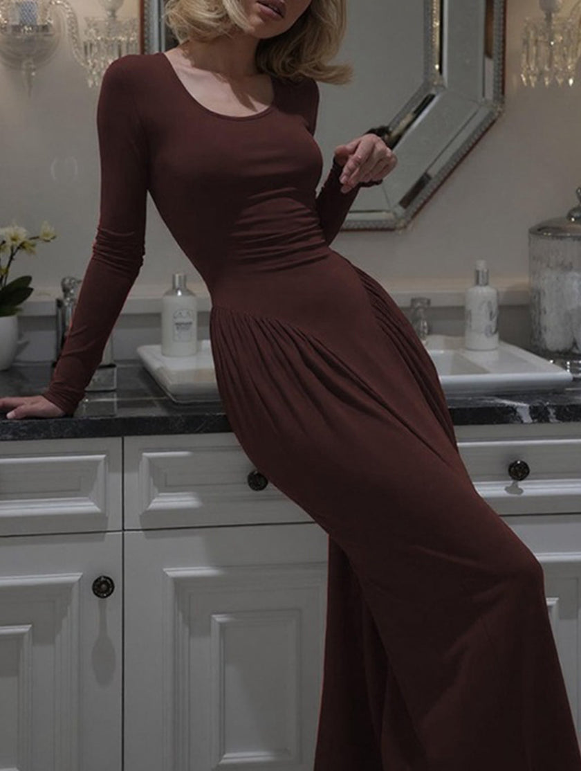White solid U-neck fit and flare dress by FJØRNA, shown in image with elegant design and knee-length silhouette.