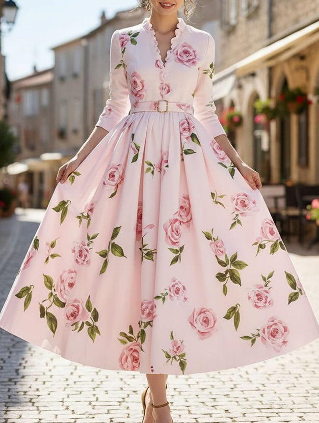 White print V-neck waist A-line dress by FJØRNA, featuring a flattering silhouette and elegant design with floral print detail.