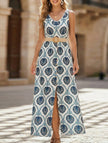 FJØRNA floral print sleeveless dress with slit, white dress featuring blue floral pattern, perfect for summer or casual occasions.