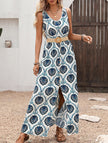 FJØRNA floral print sleeveless dress with a slit, white dress featuring vibrant blue floral patterns, perfect for summer wear.