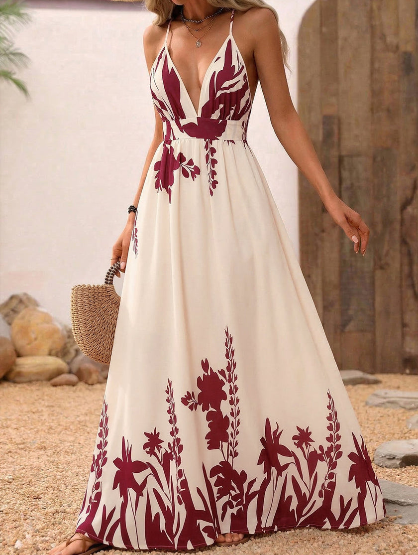 Red floral print backless cami maxi dress by FJØRNA, flowing design with shoulder straps and a vibrant, elegant pattern.