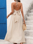 Light khaki backless sleeveless FJØRNA maxi dress with elegant design, flowing style, perfect for formal or summer occasions.