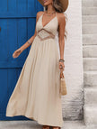 Light khaki backless sleeveless FJØRNA maxi dress with elegant design, flowing fabric, and floor-length style.