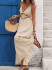 Light khaki backless sleeveless maxi dress by FJØRNA featuring an elegant, flowing design perfect for formal occasions.