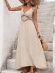 White backless sleeveless maxi dress by FJØRNA, elegant design, flowing fabric, perfect for formal or summer occasions.
