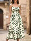 FJØRNA leaf print white cami waist maxi dress with green foliage pattern, flowing sleeveless design, perfect for summer.