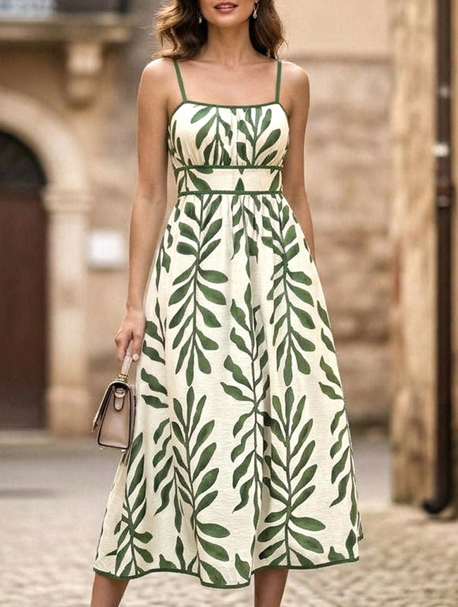 FJØRNA leaf print white cami waist maxi dress with green foliage pattern, flowing sleeveless design, perfect for summer.