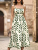 FJØRNA leaf print white cami waist maxi dress with green foliage pattern, flowing sleeveless design, perfect for summer.