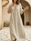 White linen V-neck loose maxi dress by FJØRNA, flowing and lightweight, perfect for casual or summer wear.