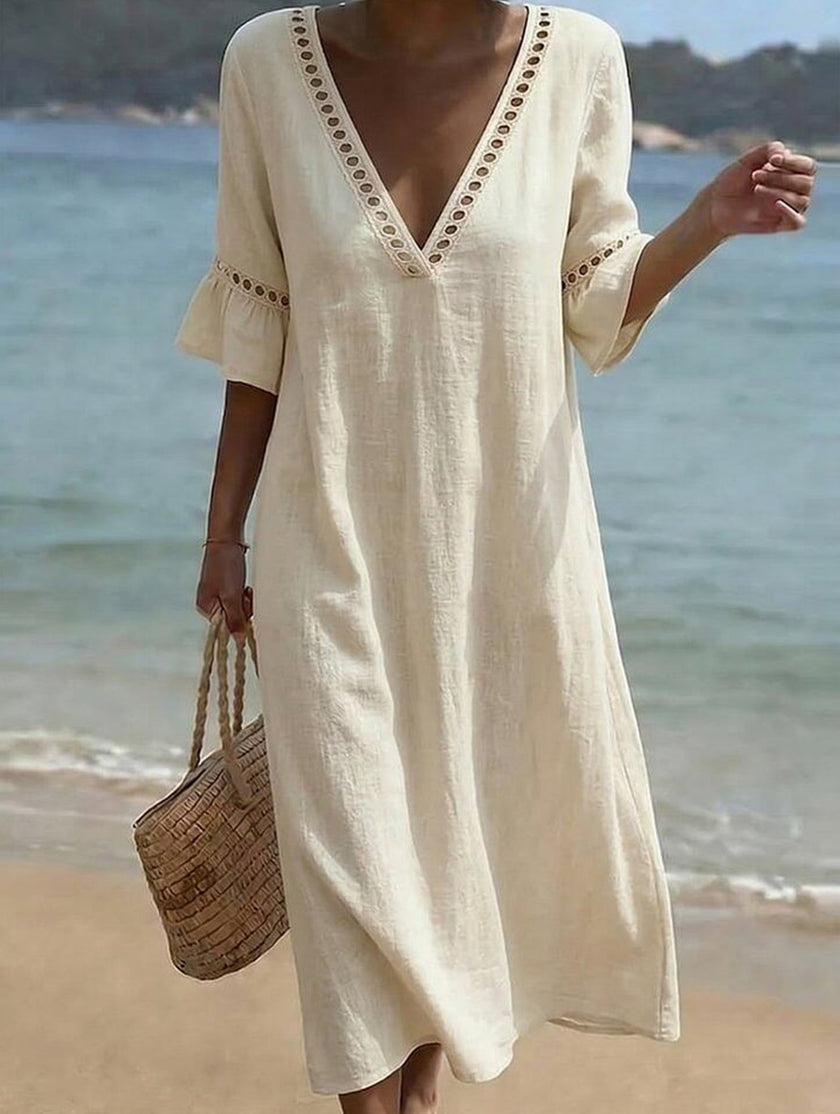 White linen V-neck loose maxi dress by FJØRNA, flowing and lightweight, perfect for casual or summer wear.