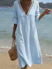 White linen V-neck loose maxi dress by FJØRNA, flowing and lightweight, perfect for casual summer wear.