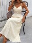 White FJØRNA halter lace patch V-neck maxi dress with flowing fabric and elegant design, perfect for summer occasions.