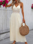 White FJØRNA halter lace patch V-neck maxi dress with flowing silhouette and intricate lace details, perfect for elegant occasions.