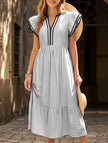FJØRNA colorblock stripe flutter sleeve dress in white with black accents, featuring a stylish and flowy design.
