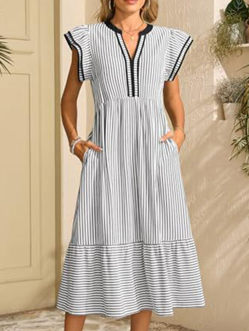 FJØRNA colorblock stripe flutter sleeve white dress with black accents, featuring a stylish and comfortable sleeveless design.