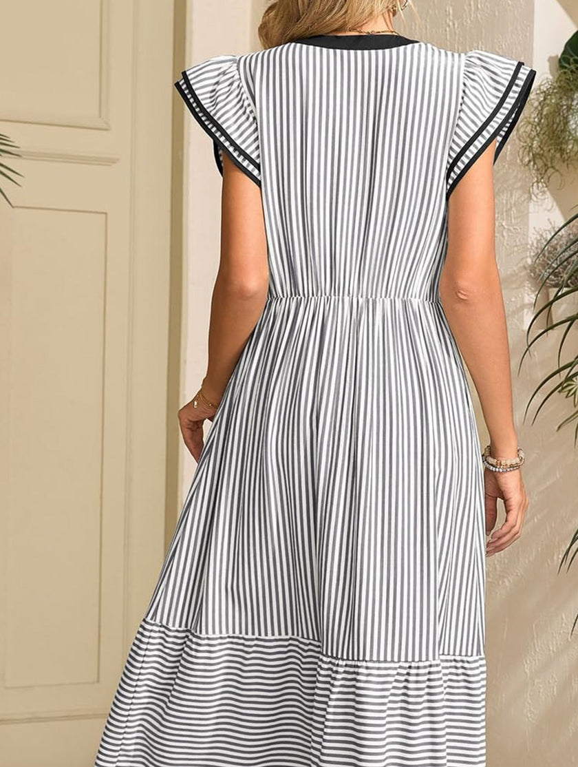 FJØRNA colorblock stripe flutter sleeve dress in black and white, casual sleeveless dress with vibrant pattern and relaxed fit.