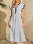 FJØRNA colorblock stripe flutter sleeve white dress with contrasting black accents, stylish and comfortable for casual wear.