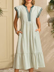 FJØRNA colorblock stripe flutter sleeve white dress with green accents, stylish and lightweight for casual or semi-formal wear.