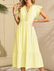 FJØRNA colorblock stripe flutter sleeve dress in white with yellow accents, showcasing a stylish and comfortable dress design.