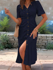 White doll collar short sleeve dress by FJØRNA, featuring a classic design and clean lines, displayed on a hanger.