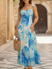 Blue floral print flowy cami maxi dress by FJØRNA, featuring a relaxed fit and elegant design, perfect for warm weather.