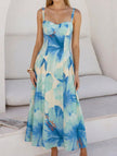 Blue floral print flowy cami maxi dress by FJØRNA, featuring a lightweight fabric and elegant design perfect for summer wear.