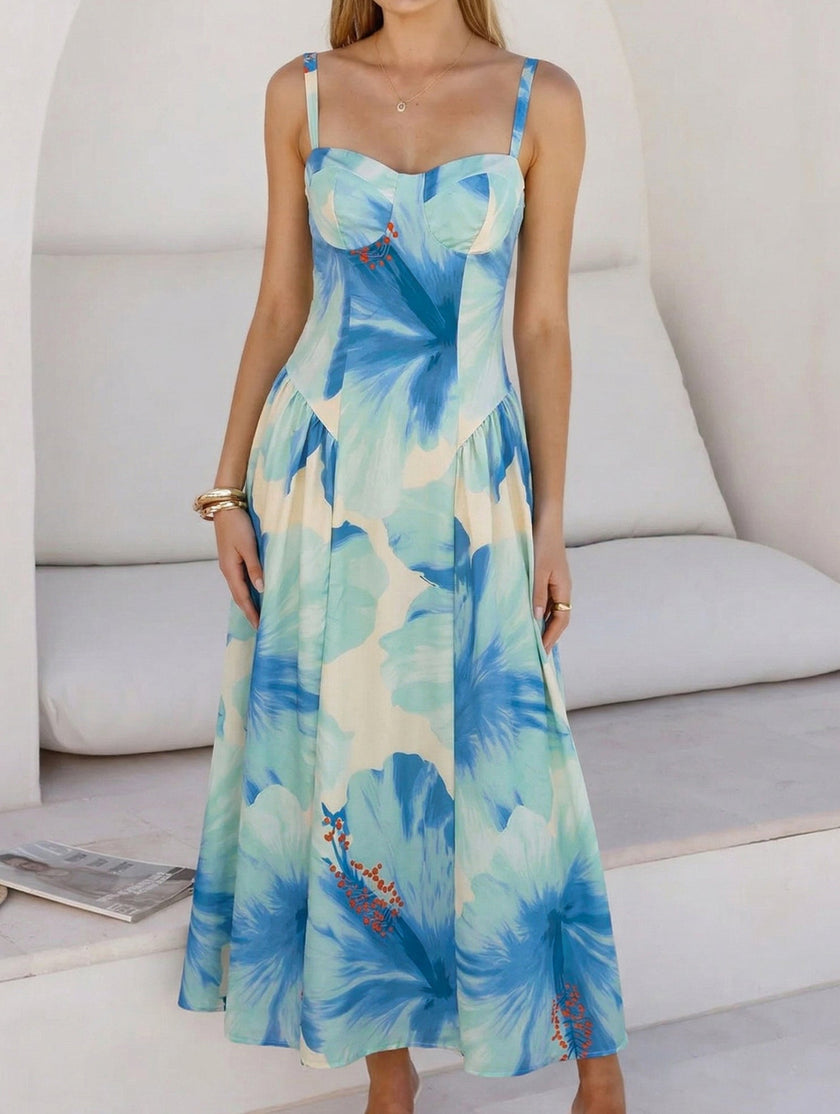 Blue floral print flowy cami maxi dress by FJØRNA, featuring a lightweight fabric and elegant design perfect for summer wear.