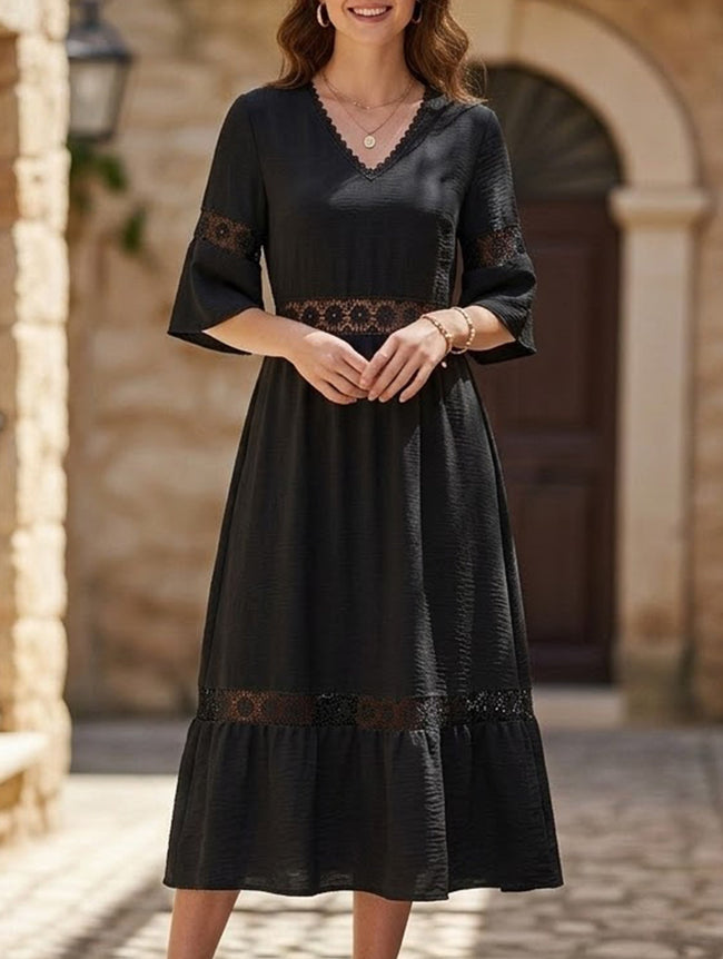Black V-neck hollow short sleeve dress by FJØRNA, featuring a stylish design and lightweight fabric.
