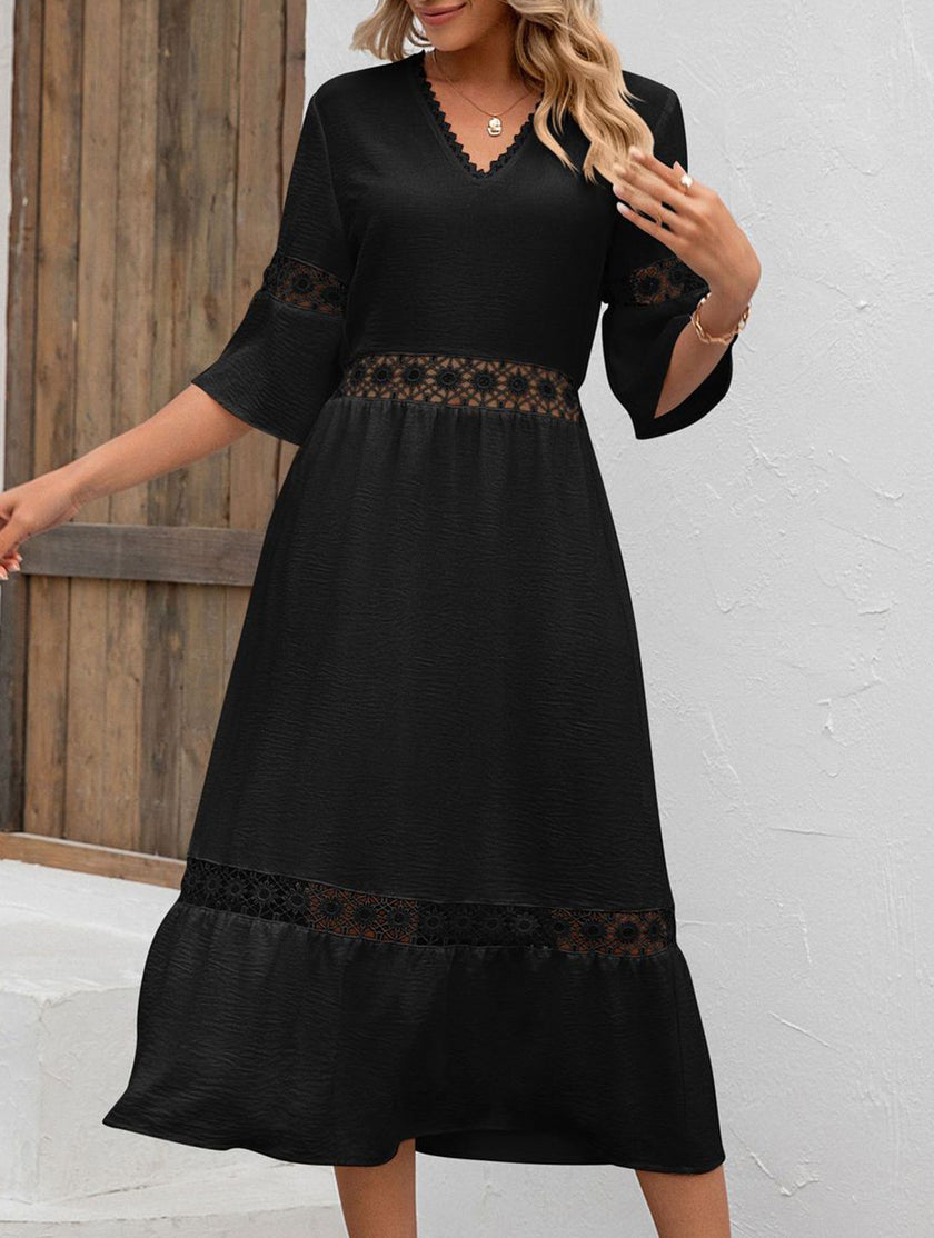 FJØRNA white V-neck hollow short sleeve dress displayed on a hanger, showcasing its sleek design and clean fabric.
