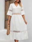 White V-neck hollow short sleeve dress by FJØRNA, showing a stylish, lightweight dress with a relaxed fit and subtle detailing.