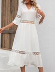 White V-neck hollow short sleeve dress by FJØRNA, featuring a stylish and lightweight design perfect for casual or semi-formal wear.