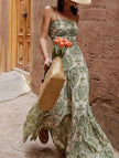 Green FJØRNA slim fit maxi dress with adjustable straps, flowing fabric, and elegant design perfect for casual or formal wear.