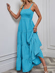 FJØRNA retro striped white maxi dress with bold blue and white horizontal stripes, flowing design, and sleeveless style.