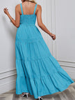 Blue retro-style striped maxi dress by FJØRNA featuring a flowing silhouette and white accents, perfect for casual or summer wear.