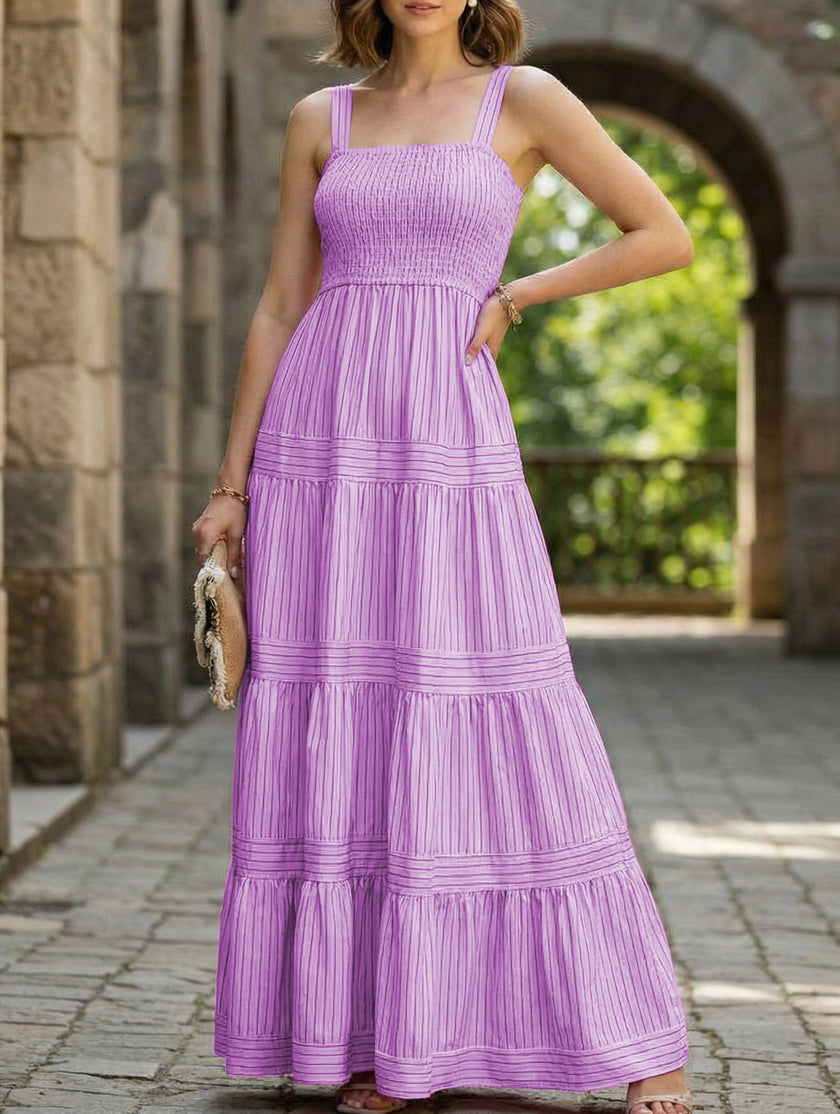FJØRNA retro style striped white maxi dress with purple accents, flowing fabric and sleeveless design, perfect for summer wear.