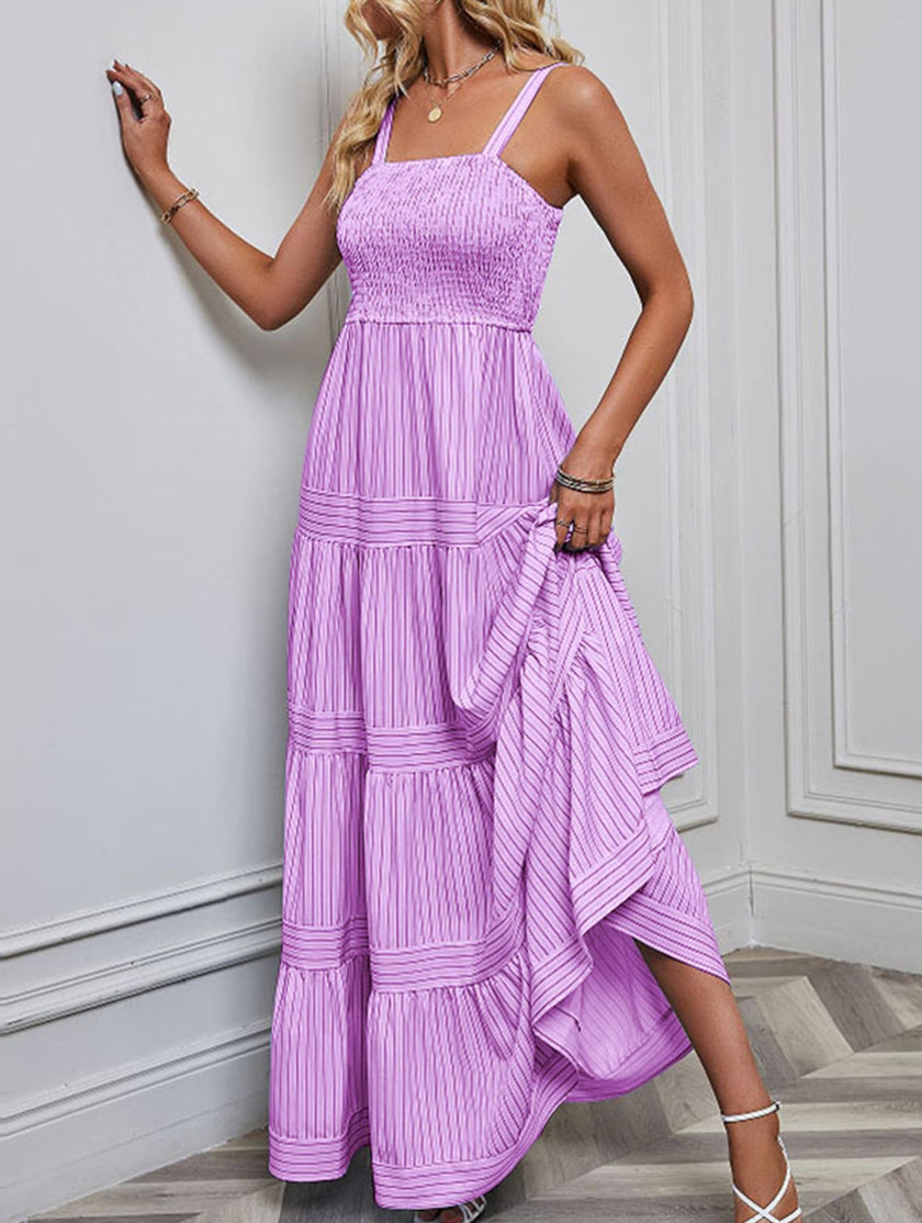 Purple retro striped maxi dress by FJØRNA featuring a flowing design and bold horizontal stripes for a stylish, vintage-inspired look.