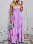 FJØRNA purple retro striped maxi dress with a flowing silhouette, sleeveless design, and bold vertical stripes.