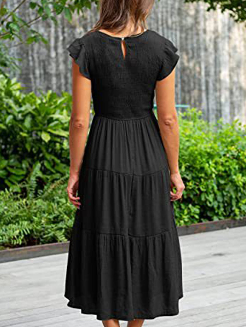 Black FJØRNA solid color cross-border sleeved dress, stylish and elegant with a fitted silhouette and long sleeves.