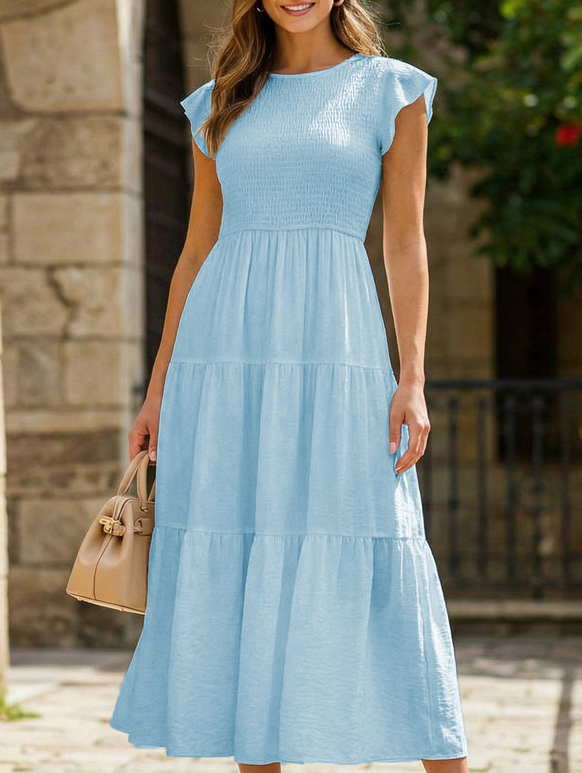 FJØRNA solid white cross-border sleeved dress, casual and elegant, shown on a model with a fitted silhouette and long sleeves.