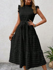 Black FJØRNA ruffled flutter sleeve tie textured dress with a fitted waist and layered skirt, stylish and elegant for special occasions.