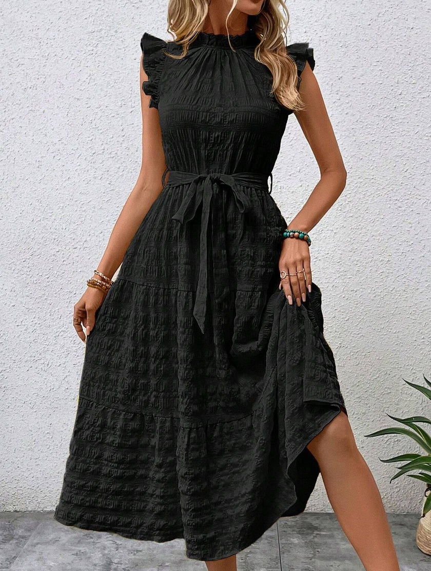 Black FJØRNA ruffled flutter sleeve tie textured dress, featuring a stylish design with ruffles and textured fabric.