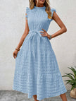 Light blue FJØRNA ruffled flutter sleeve tie textured dress with a feminine silhouette and intricate fabric details.