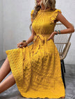 FJØRNA white ruffled flutter sleeve tie textured dress displayed on a model, showcasing its elegant design and lightweight fabric.