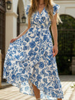 Blue FJØRNA print V-neck dress with stylish design, lightweight fabric, and elegant silhouette, perfect for casual or semi-formal wear.