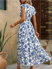 FJØRNA white V-neck dress with a fashionable print, sleeveless design, and elegant silhouette for stylish occasions.