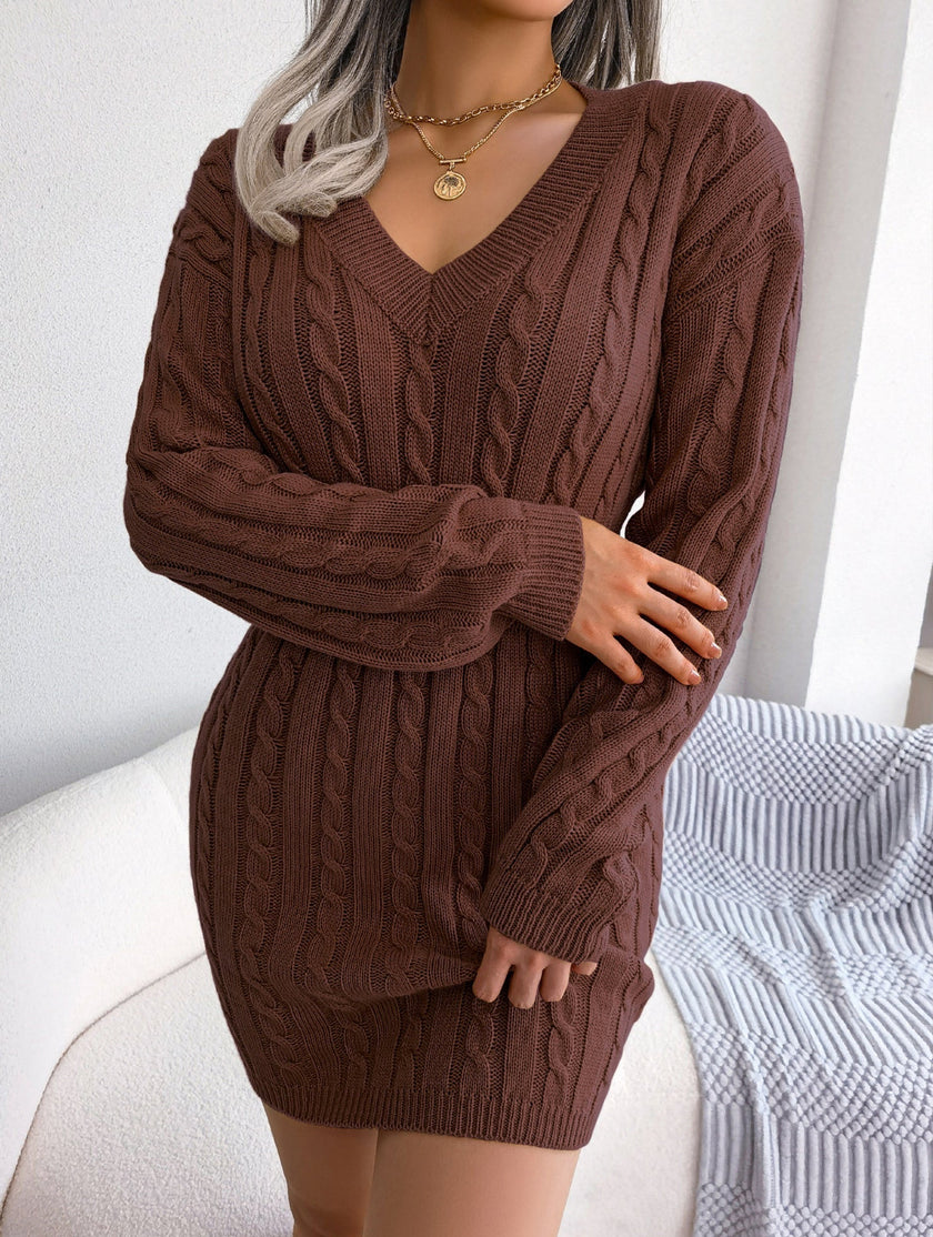 White cable-knitted waist-hugging hip dress by FJØRNA, featuring a cozy, fashionable design perfect for stylish everyday wear.